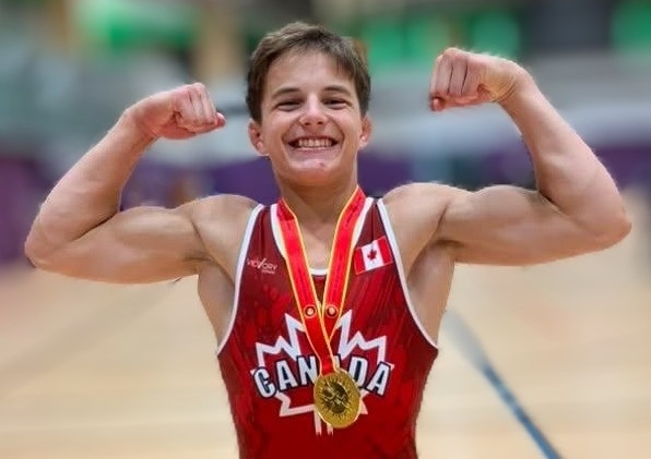 Mountaintop athlete Tanner Vautour wearing his Team Canada singlet and gold medal